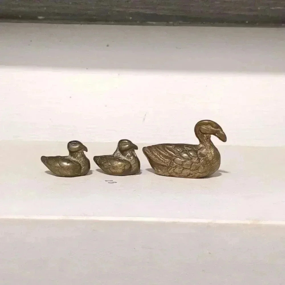 Brass duck figurines